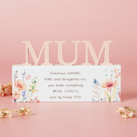 Decorative sign with 'MUM' on a pink background