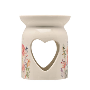 Cream ceramic wax melt burner with heart-shaped cutout and floral watercolor design featuring pink, purple and yellow wildflowers on lower sides, Cottage Garden style