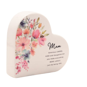 Cream ceramic heart-shaped decorative piece featuring watercolor floral design with pink, coral and purple flowers, bee detail, and black text reading Mum with sentiment about being generous, caring, kind and thoughtful