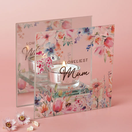 Greeting card with floral design and 'Loveliest Mum' text on a pink background