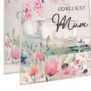 Celebrations Cottage Garden glass tealight holder featuring watercolor pink tulips and delicate flowers with a bee, displaying "Loveliest Mum" text in elegant script, includes clear glass votive cups