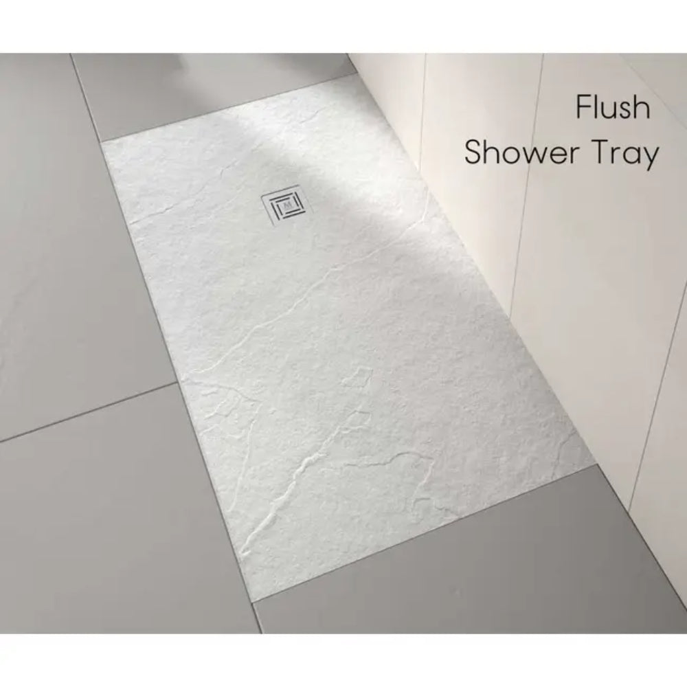 White marble effect rectangular flush shower tray with square stainless steel drain cover, installed flush with surrounding light grey floor tiles in modern bathroom