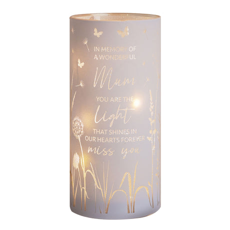 Frosted glass cylindrical tube light in soft mauve with gold foil botanical designs including dandelions and butterflies, featuring engraved memorial text reading "In Memory of a Wonderful Mum, You Are the Light That Shines in Our Hearts Forever, Miss You"