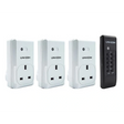 Three white electrical outlets and a black remote control with 'UNI-COM' branding on a white background.