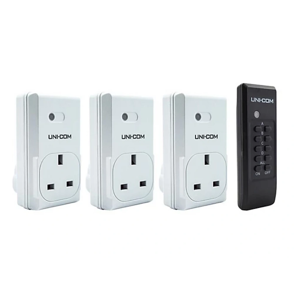 Three white electrical outlets and a black remote control with 'UNI-COM' branding on a white background.