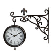 Decorative wall clock with ornate metal bracket on a white background