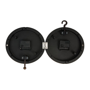 Rear view of two black circular wall clocks showing battery compartments and mounting hardware, with one clock featuring a hook hanger on top