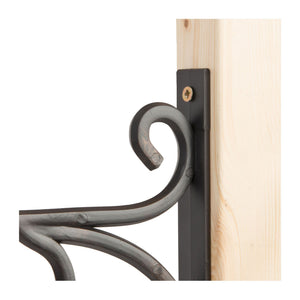 Black wrought iron wall bracket with curved scroll design mounted on light wooden surface, featuring brass screw detail for hanging clocks or decorative items