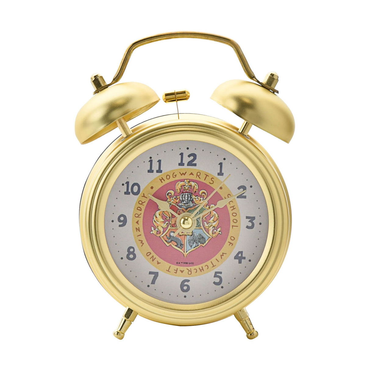 Gold alarm clock with Hogwarts crest on a white background
