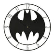 Black bat-shaped clock with white accents on a white background