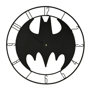 Black bat-shaped clock with white accents on a white background