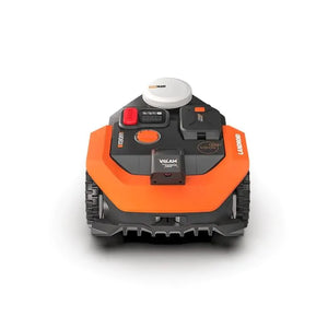 Top-down view of Worx Landroid Vision AI RTK orange and black robotic lawnmower with white GPS module on top, control panel with red emergency stop button, and tracked wheels for lawn mowing up to 500m2